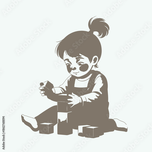 Little girl playing with blocks on floor in casual clothes and hair bun