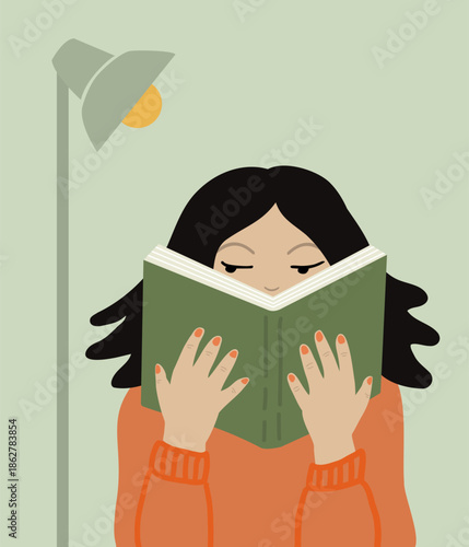 Woman reading, absorbed in her book.