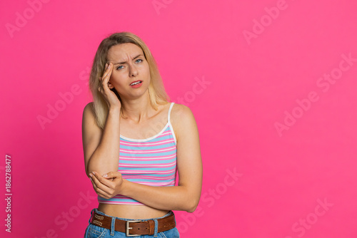 Принти на полотні Displeased exhausted Caucasian young woman rubbing temples to cure headache problem, suffering from tension, migraine, stress