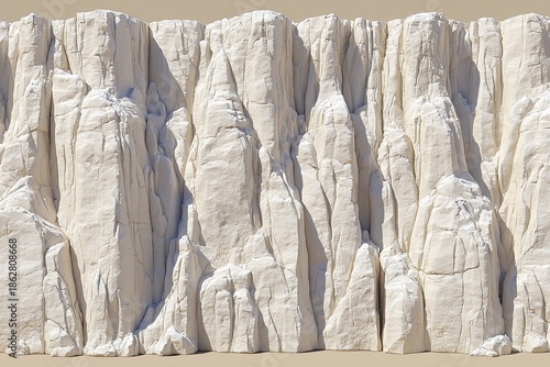 Rough, vertical white rock wall with deep vertical grooves, textured