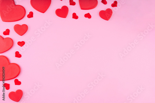 Valentine day pink greeting card background with red hearts