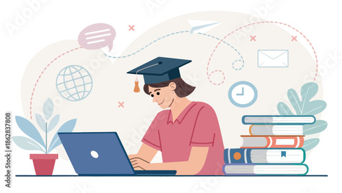 Student in graduation cap working on laptop with books