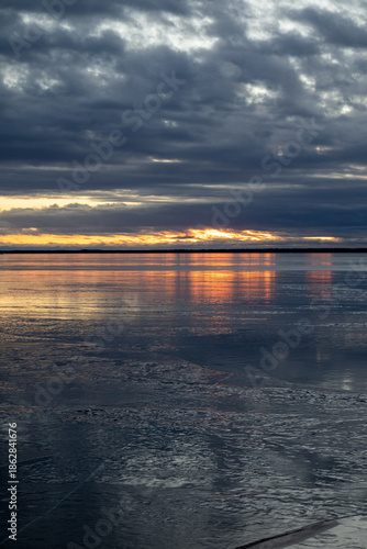 winter sunset above the frozen sea in Nallikari Oulu, Finland