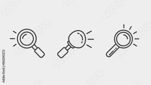Magnifying glass icons with light rays.