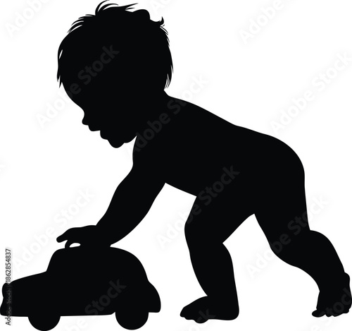 Cute infant silhouette playing with a small toy car on the floor engaging in imaginative play