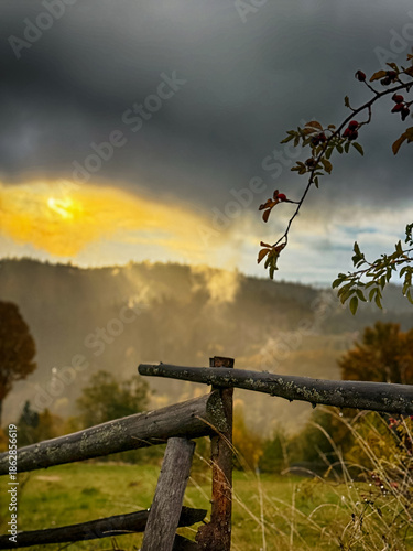 Sunny Autumn Carpathians with Puffy White During The Sunset