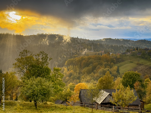 Sunny Autumn Carpathians with Puffy White During The Sunset