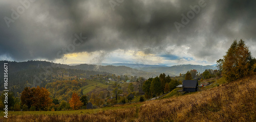 Sunny Autumn Carpathians with Puffy White During The Sunset