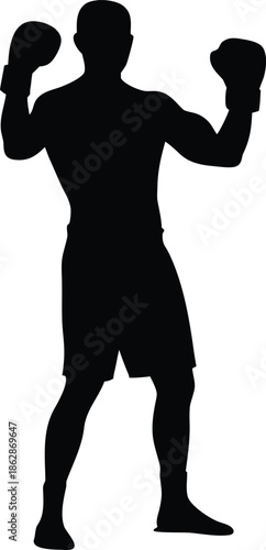 Full body silhouette of a powerful male boxer standing in a prepared fighting stance