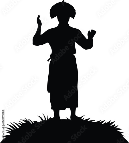 Majestic figure silhouette with unique headdress standing on a grassy mound with arms raised