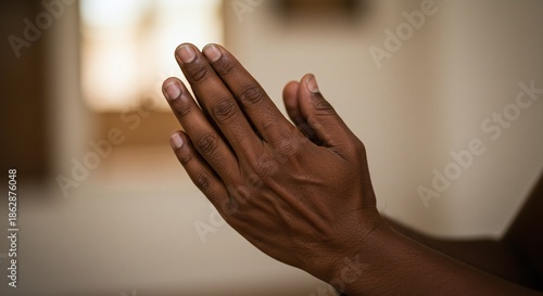 Close of hands with palms together symbolizing faith, prayer, and devotion to Jesus