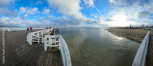 Large panoramic view of the wooden pier and beach in Sopot, Pomerania
