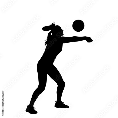 Silhouette of a female volleyball player spiking the ball.
