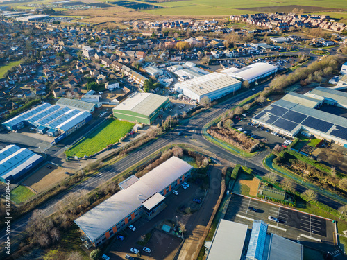 Interesting UAV view of modern industrial buildings seen on the outskirts of the town of Chatteris, Cambridgeshire, UK. The industrial zone is a large employer to the market town.