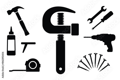 Assorted black construction and woodworking tools are neatly arranged for.