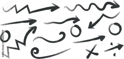 A collection of hand drawn arrows and symbols in black on a white background