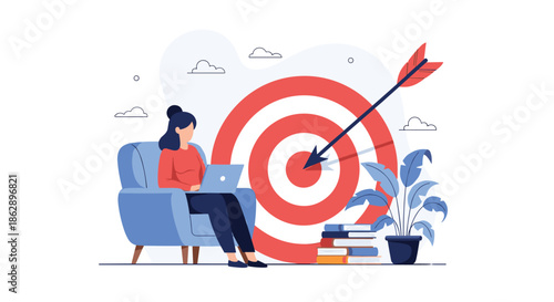 Focused woman sitting in armchair working on laptop with large bullseye target and arrow hitting center behind her.