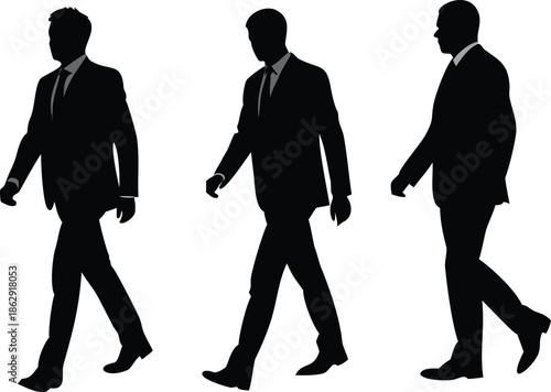 Three business professionals are walking forward in a confident and determined manner