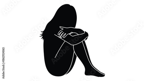 Silhouette of a woman seated with knees drawn up appearing distressed