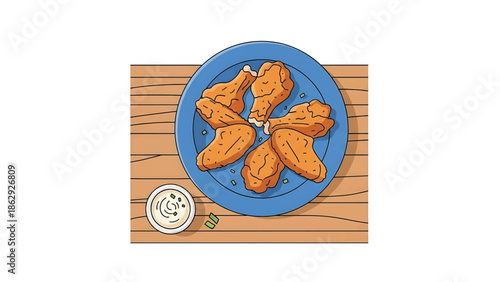 A top-down view of a blue plate holding cooked chicken wings. A small bowl of dip with green onions is on the left. The scene is set on a wooden surface