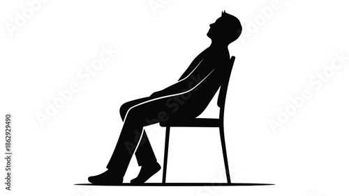 A silhouette of a man relaxing and leaning back in a chair
