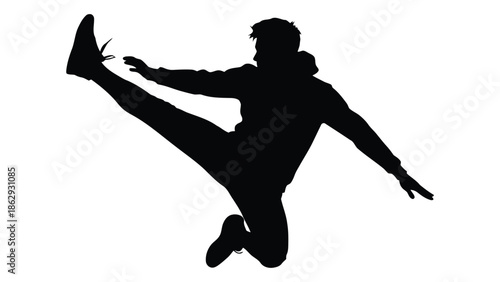 Silhouette of a person dynamically kicking in mid air exhibiting athletic energy