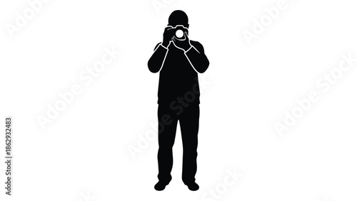 Silhouette of a photographer taking a picture with a camera