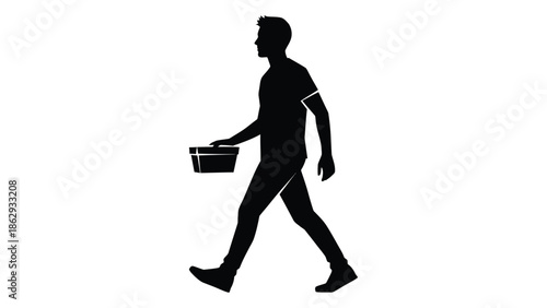 Silhouette of a man walking and carrying a small rectangular container