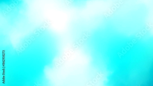 A serene landscape with clouds against a vibrant blue sky viewed from below