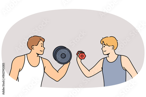 Sports competition between men lifting dumbbells with different weights or fitness mentoring in gym. Professional fitness trainer motivates student to engage in sports or bodybuilding