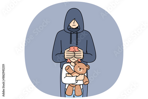 Maniac closes eyes of little girl with children toy, for public service announcement against pedophilia and child abduction. Criminal and hooded maniac wants to commit violent acts.