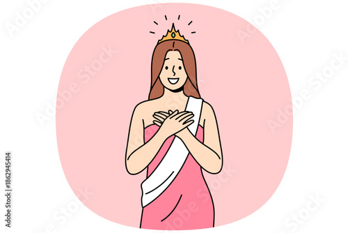 Woman won beauty contest smiles with hands on chest, dressed in dress with winner ribbon and gold crown. Young girl won beauty contest smiles, enjoying moment of triumph and glory.