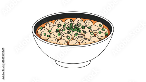 Large bowl of savory meatball soup garnished with fresh chopped green onions served in a simple white ceramic bowl against a plain white background.