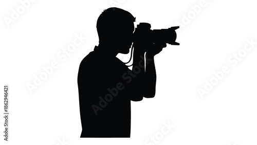Silhouette of a photographer taking a picture with a professional camera
