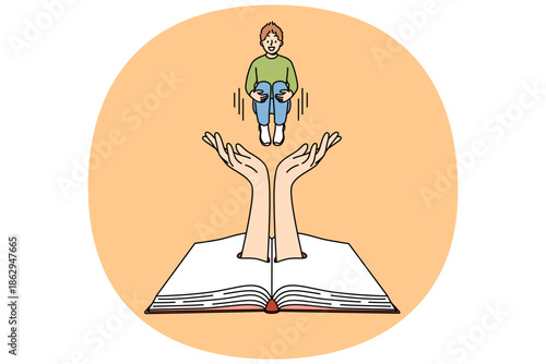 Little boy jumps above book, diving into plot of fantastic literature with exciting adventure story. Giant hands in childrens textbook symbolize intriguing literature in bookstore.