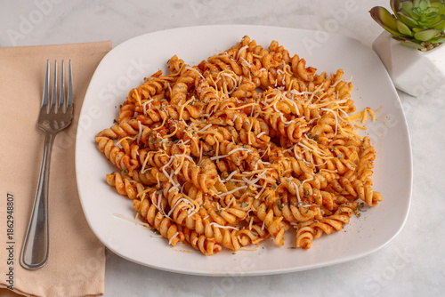 rotini pasta  with herbs and cheese