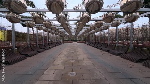 Wallpaper Mural A walk through a picturesque city park in Krasnodar, Russia. Modern architecture, lush greenery, and captivating views. Habitat. Man and nature. Urban geometry Torontodigital.ca