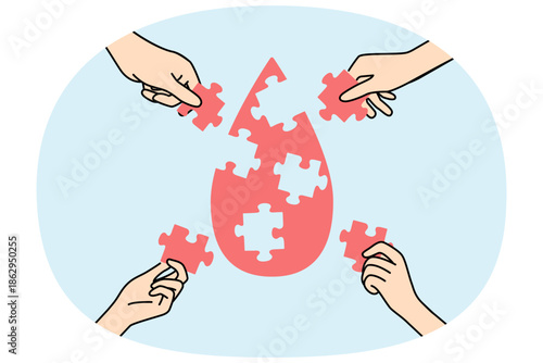 Drop of blood from puzzles in hands, as metaphor for donation and fight against cancer caused by leukocyte disease. People donate blood to help sick patients in need of plasma transfusions
