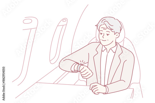 Ensure safety measures before flight takes off, Business traveler fastens seatbelt prior to takeoff in airplane, Passenger diligently secures safety belt in calm airline setting before flight departs
