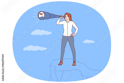 Visionary business woman with strategic thinking stands on top of cliff using spyglass. Successful girl makes visionary plans for future to develop strategy to achieve ambitious goal