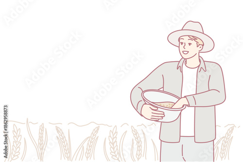 Agricultural worker collects wheat in sunlight, Rural farmer harvesting crop amidst sunlit fields and gentle wind, Field worker diligently gathers ripe wheat under clear skies with carefree expression