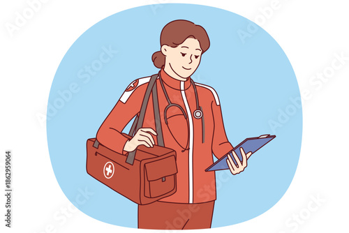 Woman doctor working in ambulance and 911 service is wearing red uniform and holding clipboard. Ambulance girl arrived at scene of incident to save life of patient who was in trouble or had fracture.