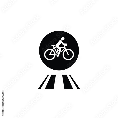 Black silhouette cyclist on bicycle within circle above road markings