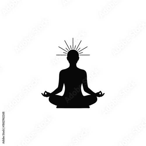 Black silhouette of a person meditating with sunburst