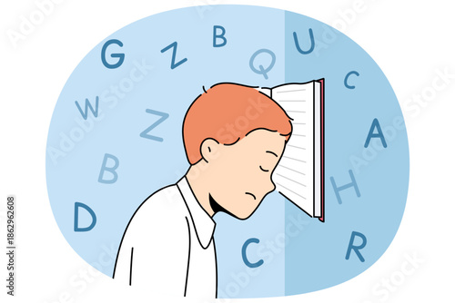 Boy with school textbook, tired due to grueling lessons and difficult homework, stands with head resting on book. Primary school student needs rest to avoid overexertion and depression.