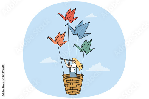 Woman travel flying in basket of origami swans and exploring world with spyglass. Girl dreams of travel and adventure, fantasizing about possibility of fly across sky on paper birds.