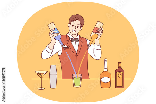 Man bartender mixes cocktail from different alcoholic drinks standing at bar counter of nightclub. Experienced bartender prepares signature drink from liquor and syrup during holiday party or festival