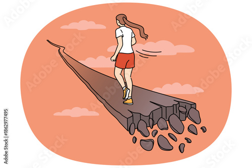 Woman runs along crumbling path, for concept of overcoming problems and escaping from crisis. Last chance to save yourself for girl who needs help getting out of personal or career crisis