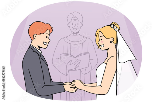 Marriage ceremony of man and woman holding hands, standing near altar with candlestick. Marriage of religious catholics wishing to get married and receive blessing from holy father