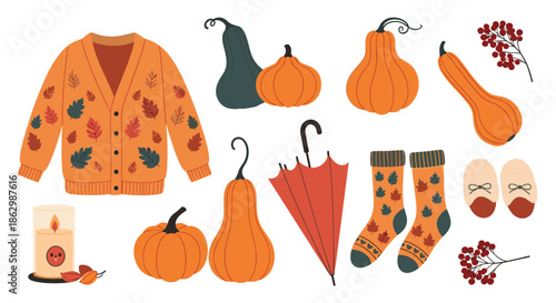 Collection of cozy autumn items including patterned cardigan, pumpkins, umbrella, socks, slippers, and a candle.